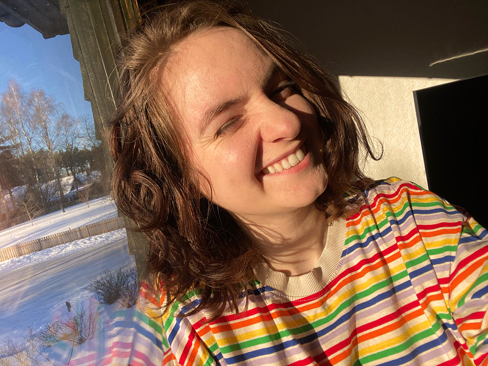 Sarah Hohmann wearing a rainbow tshirt to express the LQBTQ+ Community and to express her own sexuality