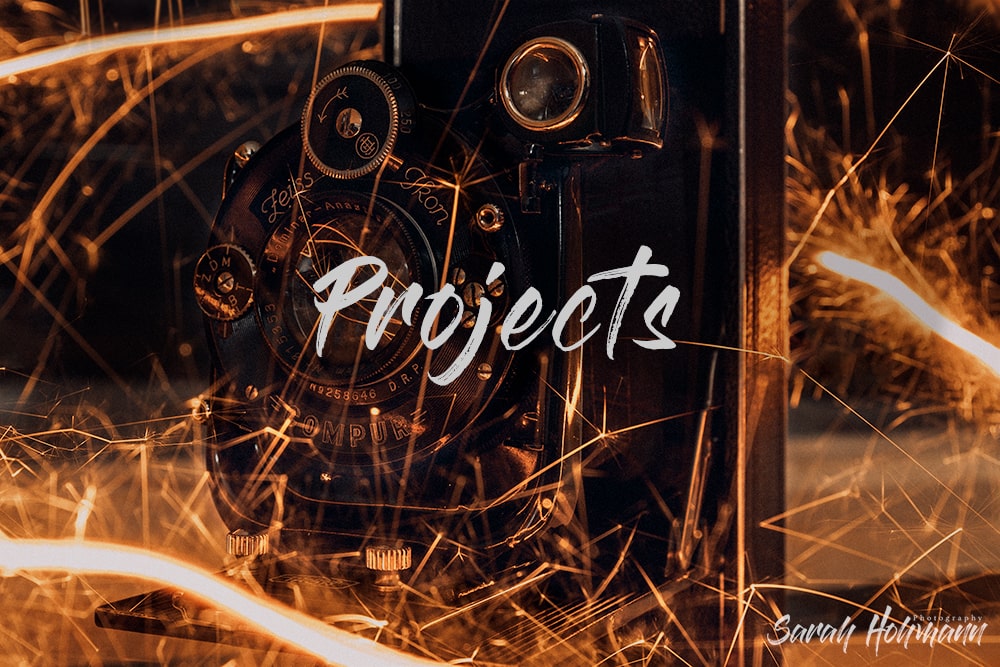 title image for the category Projects Photography, displaying an old vintage camera surrounded by fire sparklers