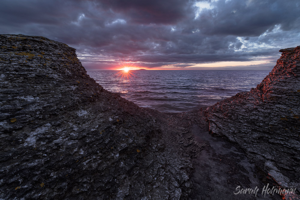 Sea stacks hit with beautiful red light during sunset on the coast of Öland